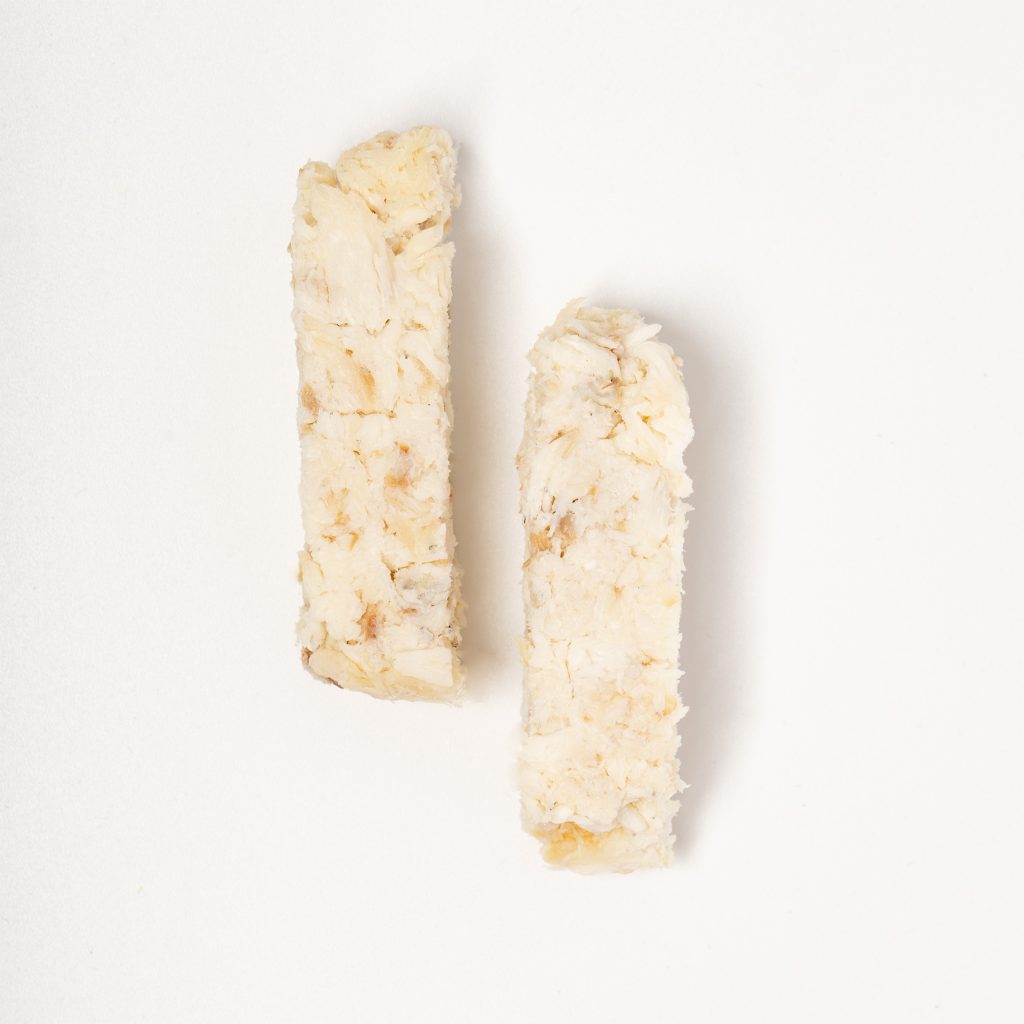 Ground dorado formed into sticks on a white background