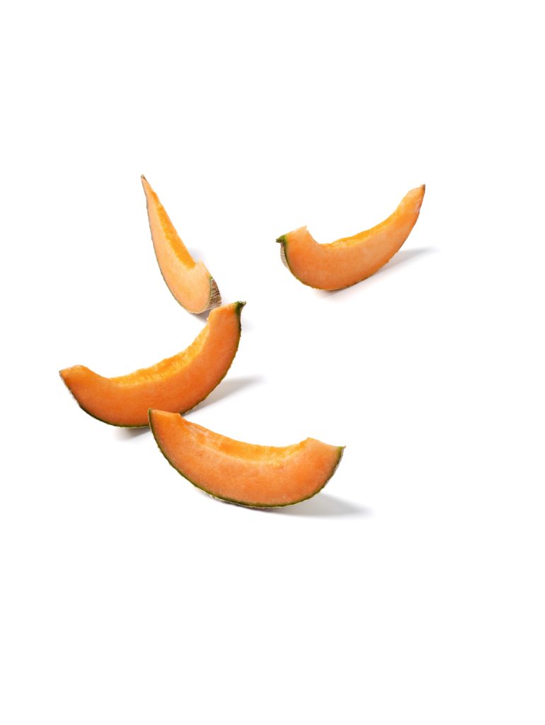 Slices of melon on a white background